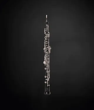 An oboe is a black wooden instrument similar to a clarinet.